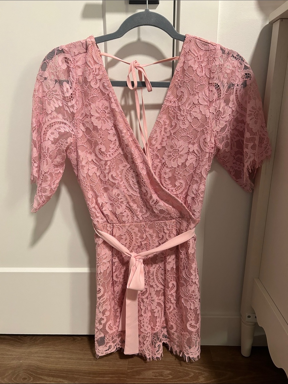 Francesca's Collections Pink Lace Wrap Romper with Tie